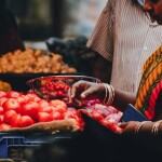 Indian women buying fresh produce from market -relates to Demand & Supply: How Markets Create What You Buy, Marketplace