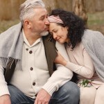 Happy Senior Couple in a Park - relates to Secure Retirement with New Pension Scheme: All You Need to Know About NPS