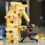 jenga game collapsing and an action figure - relates to China's Economic Slowdown: A Cautionary Tale for India's Growth