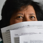 Tax filing, woman with tax forms