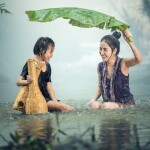 Woman, Kid, Rain image.
